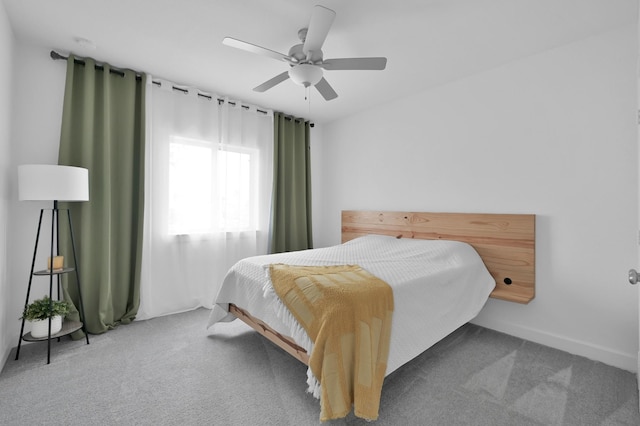 2807 Kingly Pine Trl, Conroe, TX 77385 - bedroom with carpet floors, a ceiling fan, and baseboards