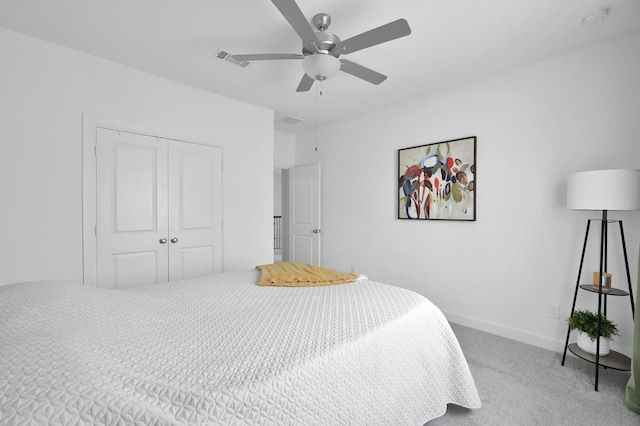 2807 Kingly Pine Trl, Conroe, TX 77385 - carpeted bedroom with a closet, baseboards, and a ceiling fan