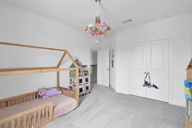 2807 Kingly Pine Trl, Conroe, TX 77385 - carpeted bedroom featuring a chandelier and a closet