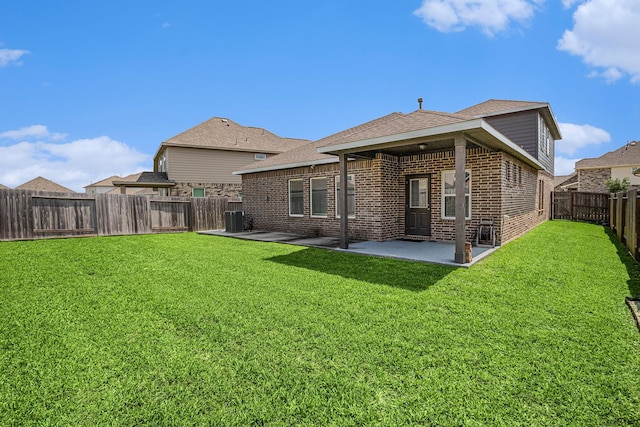 10906 Granite Chief Dr, Rosharon, TX 77583 - rear view of house featuring brick siding, a patio area, a shingled roof, and cooling unit