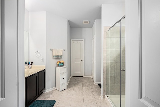 10906 Granite Chief Dr, Rosharon, TX 77583 - bathroom with vanity, a shower stall, tile patterned flooring, and baseboards