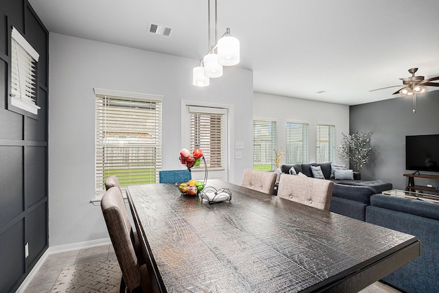 10906 Granite Chief Dr, Rosharon, TX 77583 - dining room with a ceiling fan, light tile patterned floors, and baseboards
