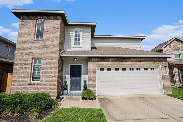 10906 Granite Chief Dr, Rosharon, TX 77583 - traditional-style house featuring driveway, brick siding, a garage, and roof with shingles