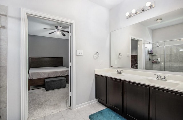 10906 Granite Chief Dr, Rosharon, TX 77583 - bathroom featuring connected bathroom, double vanity, tile patterned floors, a tile shower, and a ceiling fan