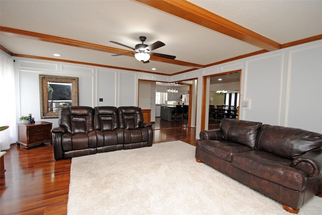 15007 Pebble Bend Dr, Houston, TX 77068 - living room featuring a decorative wall, crown molding, a chandelier, wood finished floors, and ceiling fan