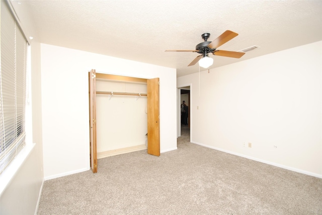 15007 Pebble Bend Dr, Houston, TX 77068 - unfurnished bedroom with carpet, a closet, baseboards, a textured ceiling, and ceiling fan