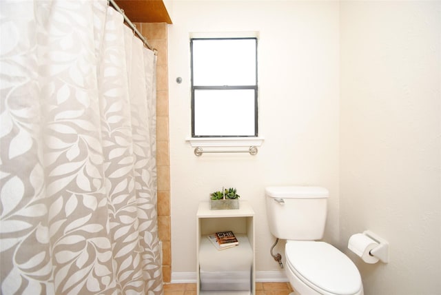 15007 Pebble Bend Dr, Houston, TX 77068 - bathroom featuring toilet, a shower with curtain, tile patterned flooring, and baseboards