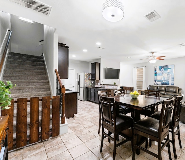 8038 Villa Lago Ln, Houston, TX 77070 - dining area featuring ceiling fan, stairway, light tile patterned flooring, and recessed lighting