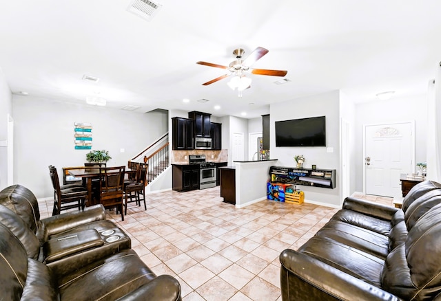 8038 Villa Lago Ln, Houston, TX 77070 - living room featuring a ceiling fan, light tile patterned flooring, and baseboards