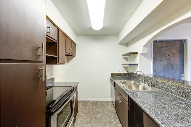 kitchen featuring open shelves, a sink, baseboards, stainless steel appliances, and arched walkways