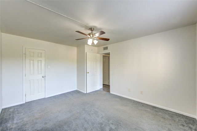 unfurnished bedroom with carpet flooring, baseboards, and a ceiling fan