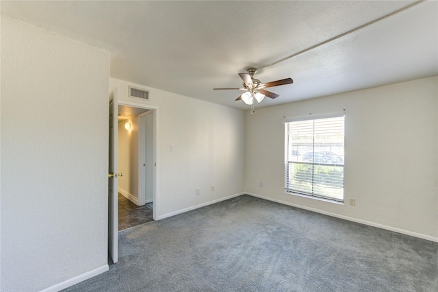 unfurnished room with carpet, ceiling fan, and baseboards