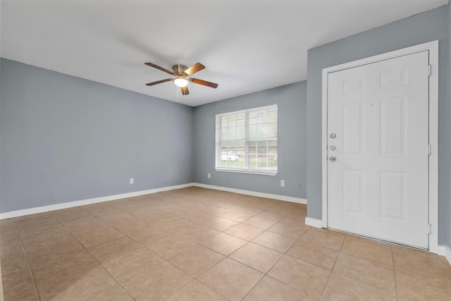 1204 Crescent Blvd, Cleveland, TX 77327 - spare room featuring ceiling fan, light tile patterned flooring, and baseboards