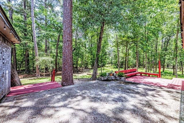 304 Inverness St, Huntsville, TX 77340 - wooden deck with a patio