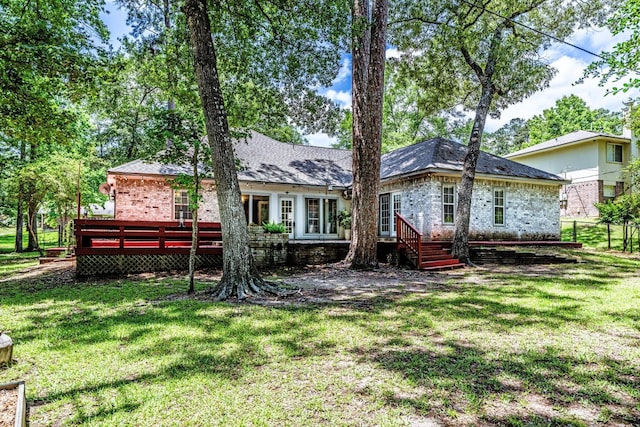 304 Inverness St, Huntsville, TX 77340 - rear view of house featuring brick siding and a deck