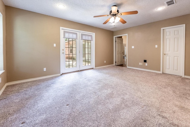 304 Inverness St, Huntsville, TX 77340 - unfurnished room featuring ceiling fan, carpet flooring, baseboards, and a textured ceiling