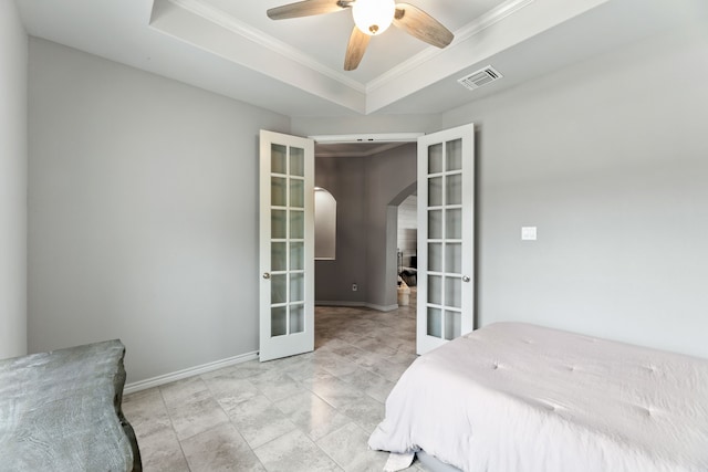 192 Primrose Path, Canyon Lake, TX 78133 - bedroom with french doors, arched walkways, ornamental molding, baseboards, and a raised ceiling
