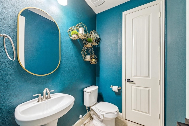 19427 Stanton Lake Dr, Cypress, TX 77433 - half bath with a sink, toilet, and baseboards