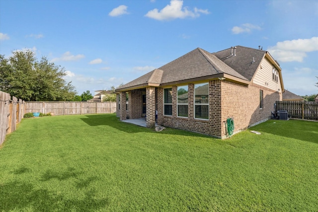 19427 Stanton Lake Dr, Cypress, TX 77433 - back of property featuring brick siding, central AC, a shingled roof, and a patio area