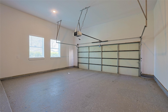 garage featuring a garage door opener, baseboards, and recessed lighting