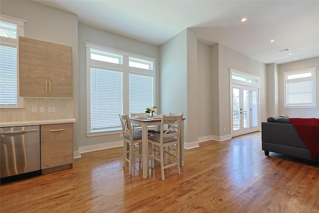 dining space featuring light wood-type flooring, french doors, baseboards, and recessed lighting