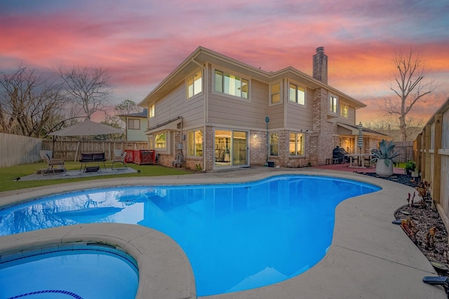 2215 Braesmeadow Ln, Sugar Land, TX 77479 - view of swimming pool with a fenced backyard, a patio, and an in-ground hot tub