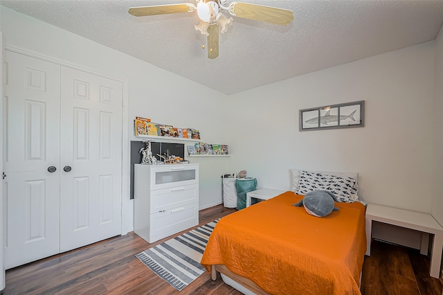 2215 Braesmeadow Ln, Sugar Land, TX 77479 - bedroom featuring wood finished floors, a closet, a textured ceiling, and ceiling fan