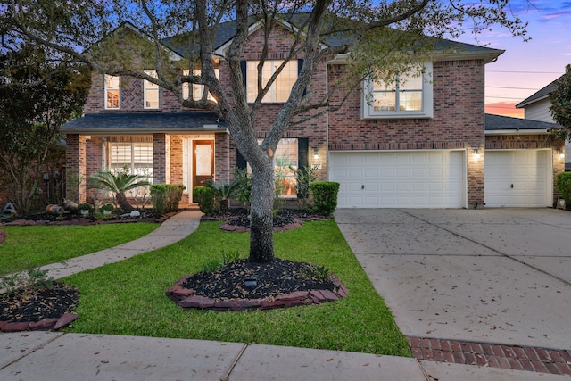 2331 Fern Bend Ln, Katy, TX 77494 - traditional home featuring driveway, brick siding, a front lawn, and a garage