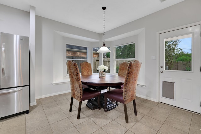 2331 Fern Bend Ln, Katy, TX 77494 - dining space with baseboards and light tile patterned flooring