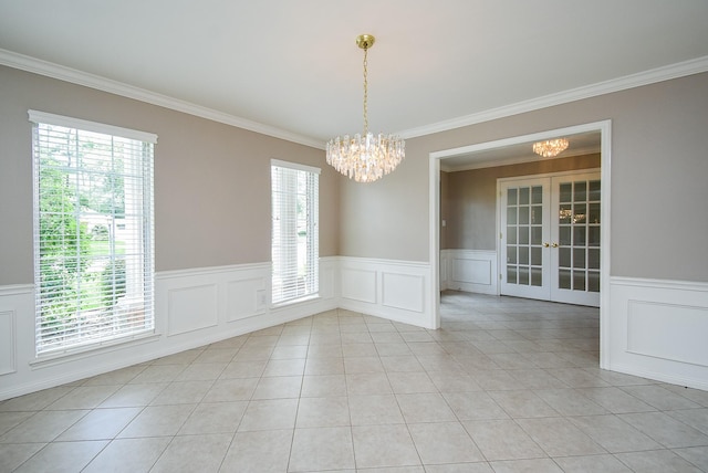 13602 Wendelyn Ln, Houston, TX 77069 - unfurnished dining area featuring a chandelier, plenty of natural light, crown molding, french doors, and wainscoting
