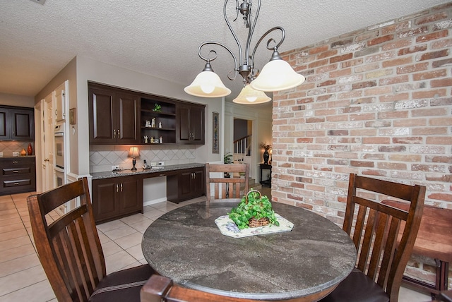 13602 Wendelyn Ln, Houston, TX 77069 - dining area with light tile patterned floors and a textured ceiling