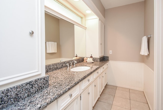 13602 Wendelyn Ln, Houston, TX 77069 - bathroom with a wainscoted wall, tile patterned flooring, and vanity