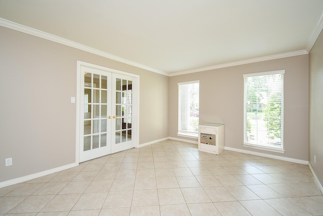 13602 Wendelyn Ln, Houston, TX 77069 - unfurnished room with french doors, ornamental molding, healthy amount of natural light, baseboards, and light tile patterned floors