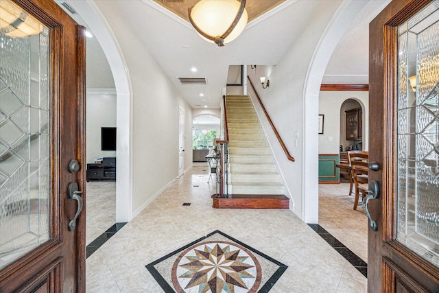 1015 W 41st St, Houston, TX 77018 - entrance foyer with arched walkways, baseboards, stairway, recessed lighting, and tile patterned floors