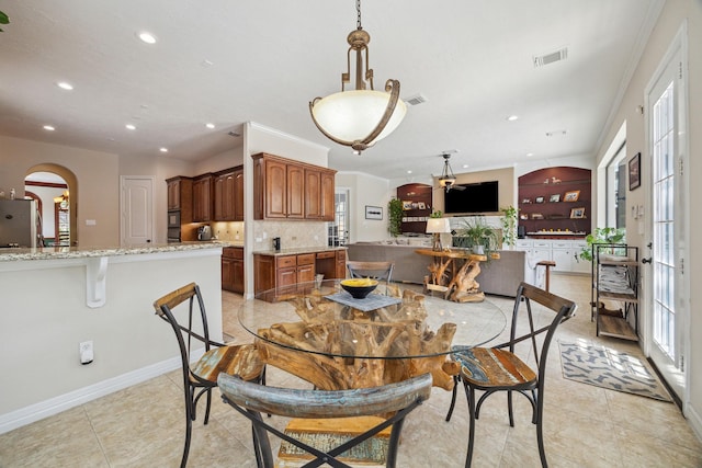 1015 W 41st St, Houston, TX 77018 - dining room with recessed lighting, healthy amount of natural light, arched walkways, baseboards, and light tile patterned floors