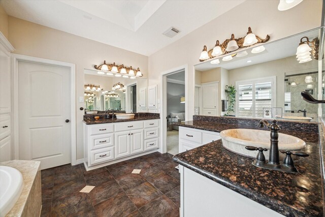 1015 W 41st St, Houston, TX 77018 - full bath with a garden tub, a shower stall, and two vanities