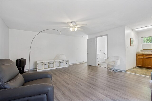 1110 Cheshire Ln, Houston, TX 77018 - living room with ceiling fan, light wood-style floors, and baseboards