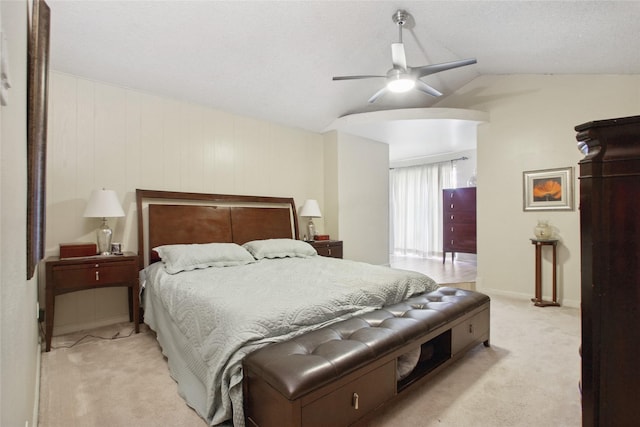 1110 Cheshire Ln, Houston, TX 77018 - bedroom featuring light carpet, vaulted ceiling, arched walkways, and ceiling fan