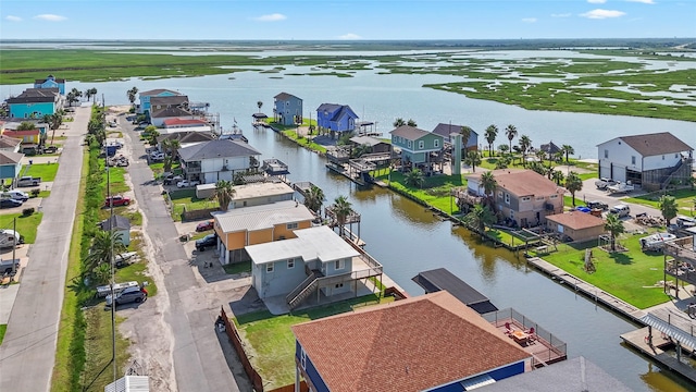 aerial view of residential area with a large body of water