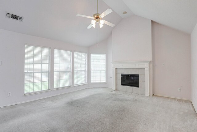 5316 Lake Mead Trl, Fort Worth, TX 76137 - unfurnished living room with plenty of natural light, light colored carpet, ceiling fan, a tile fireplace, and high vaulted ceiling