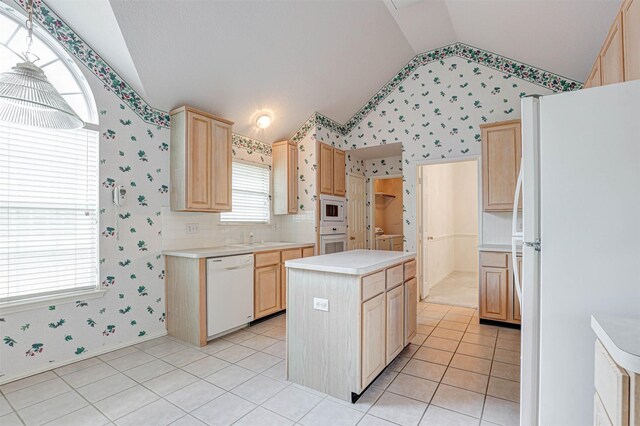 5316 Lake Mead Trl, Fort Worth, TX 76137 - kitchen with white appliances, lofted ceiling, light brown cabinets, wallpapered walls, and light countertops