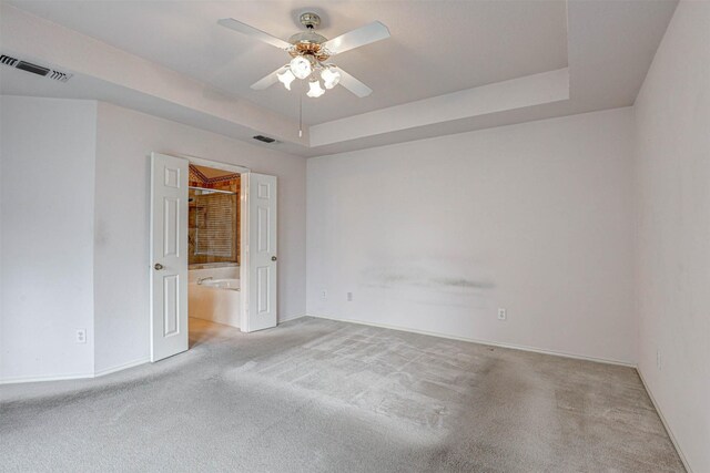 5316 Lake Mead Trl, Fort Worth, TX 76137 - unfurnished bedroom with carpet floors, baseboards, a tray ceiling, and a ceiling fan