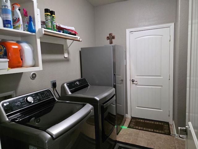 laundry area featuring washing machine and clothes dryer