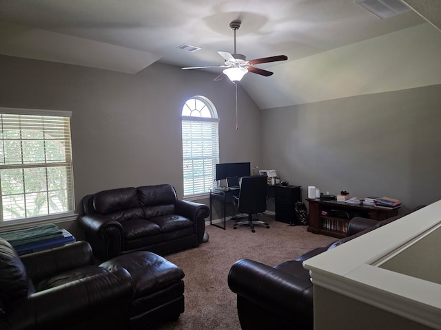 home office featuring carpet, a ceiling fan, and vaulted ceiling