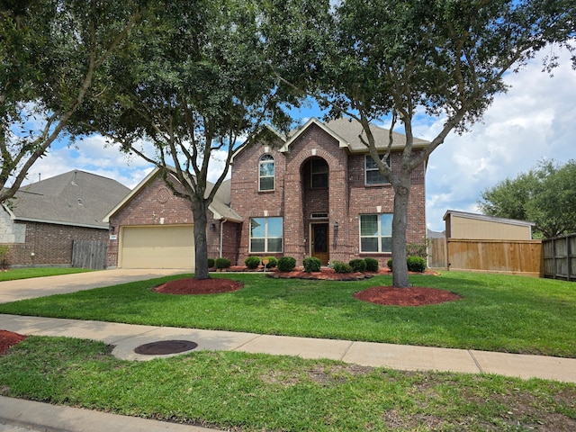traditional-style home featuring brick siding, concrete driveway, an attached garage, and a shingled roof