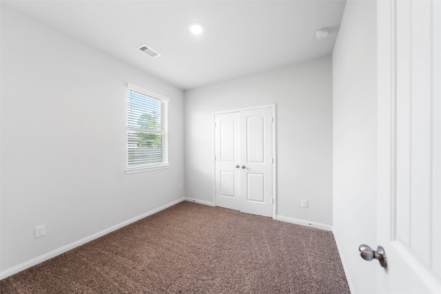 6186 White Oak Leaf Loop, Conroe, TX 77303 - carpeted spare room featuring baseboards and a smoke detector