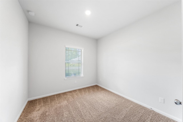 6186 White Oak Leaf Loop, Conroe, TX 77303 - empty room with carpet flooring, baseboards, a smoke detector, and recessed lighting