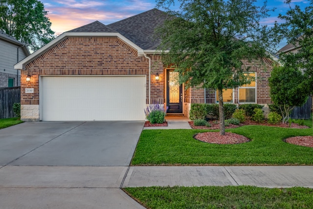 21310 Baldovin Way, Tomball, TX 77375 - view of front of house with brick siding, a shingled roof, an attached garage, and driveway