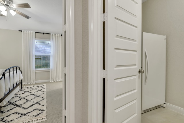21310 Baldovin Way, Tomball, TX 77375 - bedroom featuring freestanding refrigerator, baseboards, and a ceiling fan