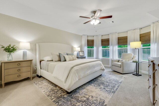 21310 Baldovin Way, Tomball, TX 77375 - bedroom with light carpet, a ceiling fan, and baseboards